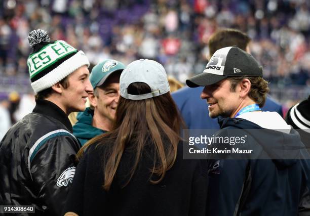 Miles Teller and Bradley Cooper attend the Super Bowl LII Pregame show at U.S. Bank Stadium on February 4, 2018 in Minneapolis, Minnesota.