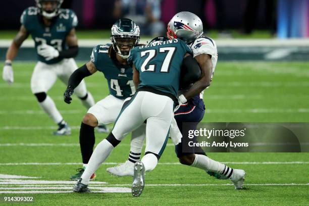 Malcolm Jenkins of the Philadelphia Eagles tackles Brandin Cooks of the New England Patriots during the second quarter in Super Bowl LII at U.S. Bank...