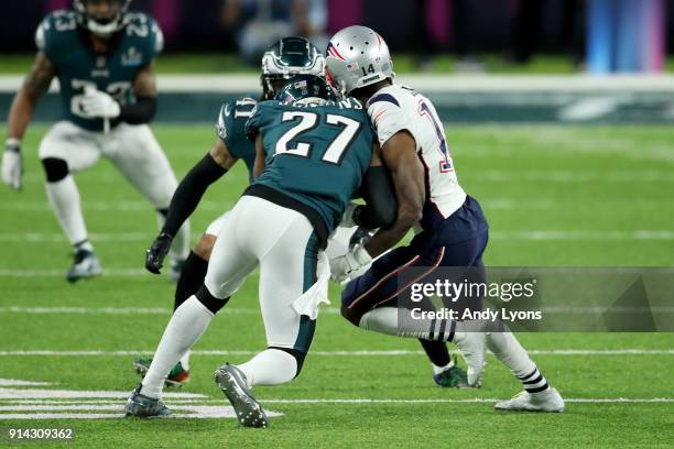 Malcolm Jenkins of the Philadelphia Eagles tackles Brandin Cooks of the New England Patriots during the second quarter in Super Bowl LII at U.S. Bank...