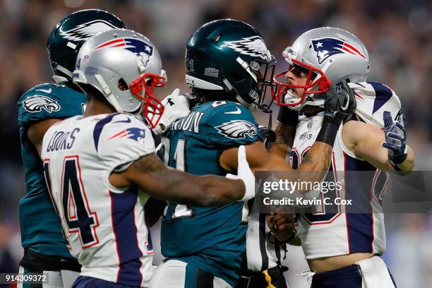 Patrick Robinson of the Philadelphia Eagles and Danny Amendola of the New England Patriots exchange words after the whistle during the second quarter...