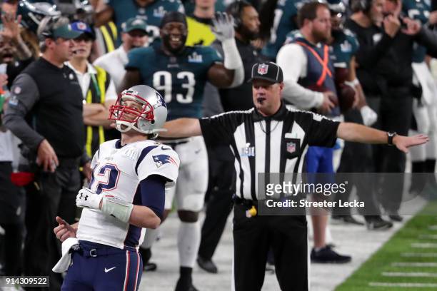 Tom Brady of the New England Patriots reacts after dropping a pass inteded for him from teammate Rob Gronkowski during the second quarter against the...