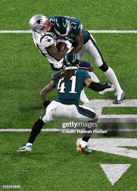 Malcolm Jenkins of the Philadelphia Eagles tackles Brandin Cooks of the New England Patriots during the second quarter in Super Bowl LII at U.S. Bank...