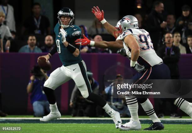 Nick Foles of the Philadelphia Eagles looks to pass the ball against Lawrence Guy of the New England Patriots during the second quarter in Super Bowl...