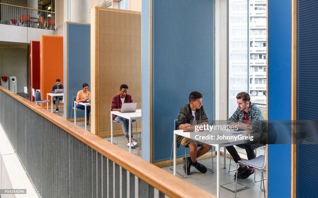 Students working in modern study cubicles at FE college