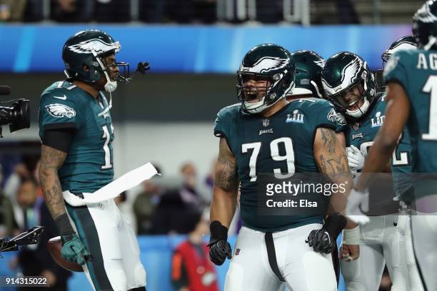 Brandon Brooks of the Philadelphia Eagles and teammate Alshon Jeffery celebrates a 34-yard touchdown pass in the first quarter of Super Bowl LII at...
