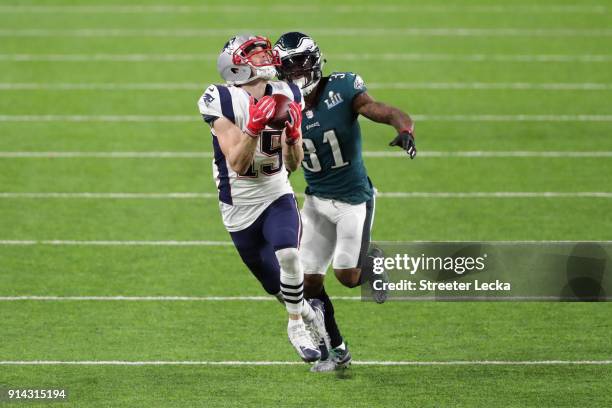 Chris Hogan of the New England Patriots catches a 43-yard reception past Jalen Mills of the Philadelphia Eagles during the second quarter in Super...