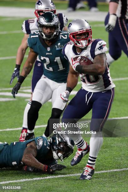 James White of the New England Patriots runs the ball past Jalen Mills of the Philadelphia Eagles for a 26-yard touchdown during the second quarter...