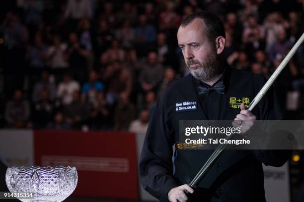 Mark Williams of Wales looks at the trophy during the final match against Graeme Dott of Scotland on day five of 2018 D88 German Masters at Tempodrom...