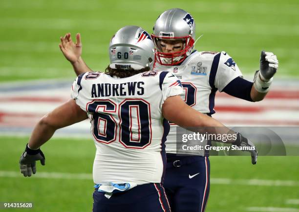 Tom Brady celebrates with David Andrews of the New England Patriots during the second quarter against the Philadelphia Eagles in Super Bowl LII at...