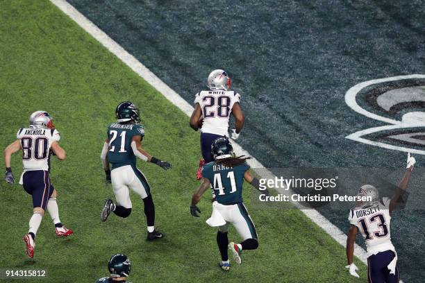 James White of the New England Patriots runs the ball for a 26-yard touchdown pass against the Philadelphia Eagles during the second quarter in Super...
