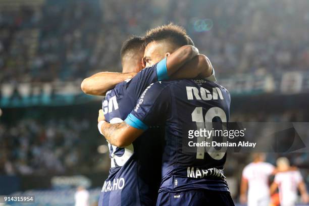 Lautaro Martinez of Racing Club celebrates with teammate Federico Zaracho after scoring the first goal of his team during a match between Racing Club...