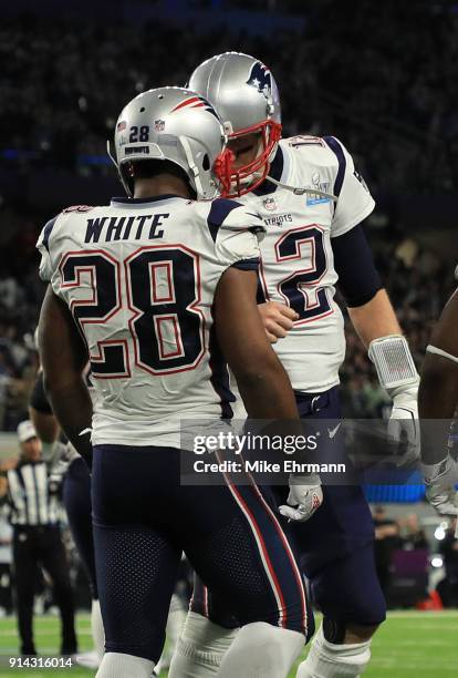 James White and Tom Brady of the New England Patriots celebrate White's 26 yard touchdown run during the second quarter in Super Bowl LII at U.S....
