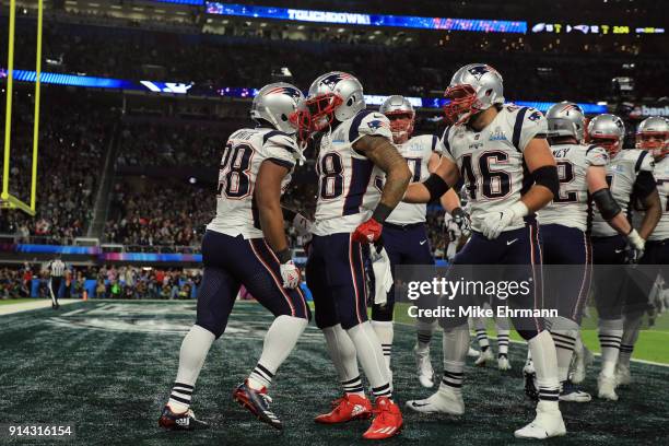 James White of the New England Patriots celebrates with teammates after a 21-yard touchdown against the Philadelphia Eagles during the second quarter...