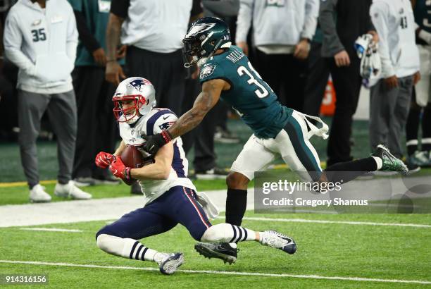 Chris Hogan of the New England Patriots catches a pass for 43 yards against Jalen Mills of the Philadelphia Eagles during the second quarter in Super...