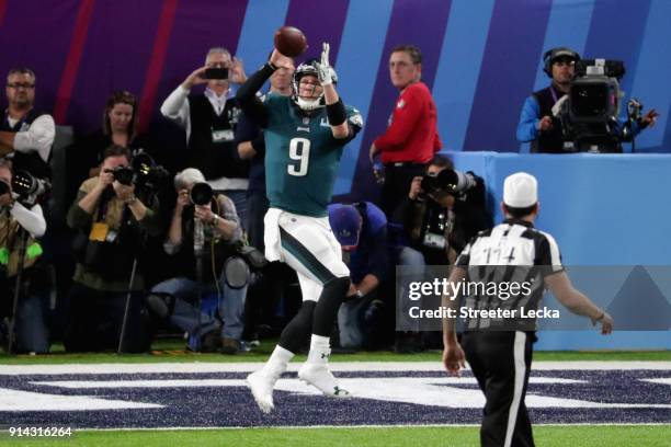 Nick Foles of the Philadelphia Eagles catches a second quarter touchdown reception from teammate Trey Burton against the New England Patriots in...