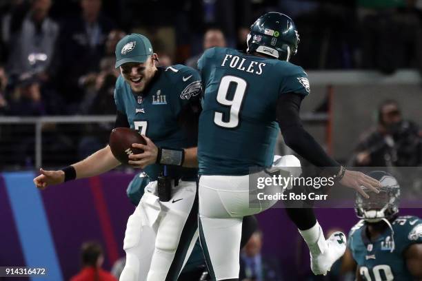 Nick Foles of the Philadelphia Eagles is congratulated by his teammate Nate Sudfeld after his 1-yard touchdown reception during the second quarter...