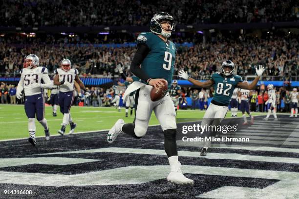 Nick Foles of the Philadelphia Eagles reacts after a 1-yard touchdown reception against the New England Patriots during the second quarter in Super...