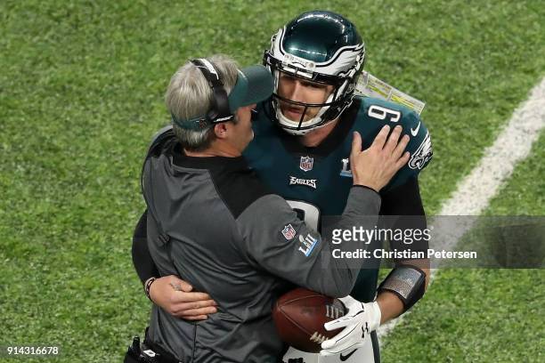 Nick Foles of the Philadelphia Eagles is congratulated by head coach Doug Pederson after his 1-yard touchdown reception during the second quarter...
