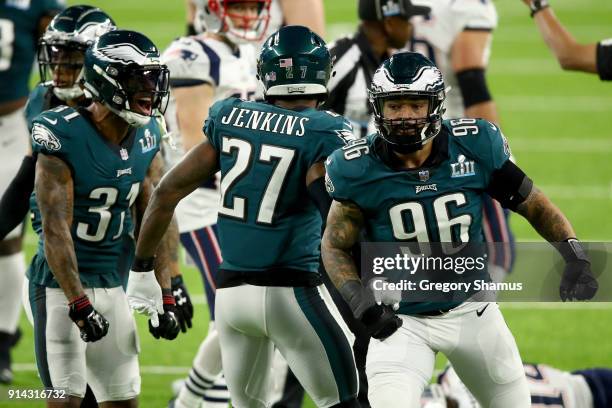 Jalen Mills, Rodney McLeod, and Malcolm Jenkins of the Philadelphia Eagles celebrate against the New England Patriots during the second quarter in...