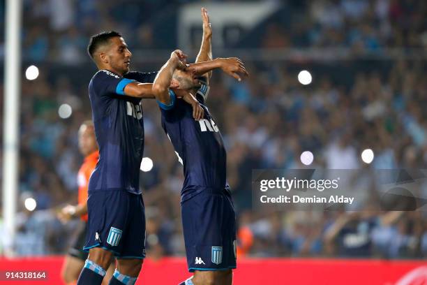 Lisandro Lopez of Racing Club celebrates with teammate Diego Gonzalez after scoring the second goal of his team during a match between Racing Club...