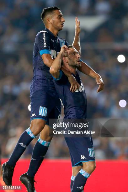 Lisandro Lopez of Racing Club celebrates with teammate Diego Gonzalez after scoring the second goal of his team during a match between Racing Club...