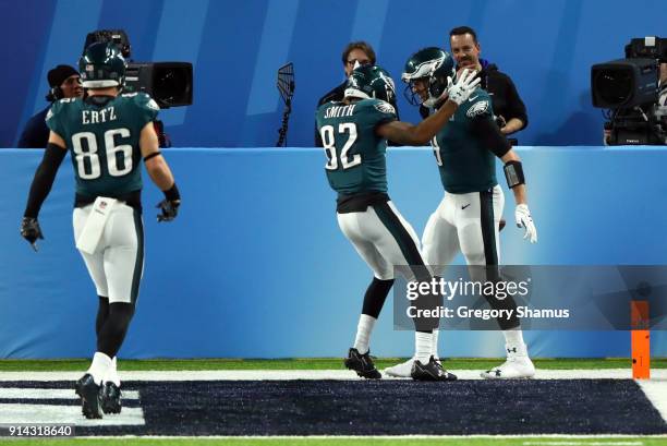 Nick Foles of the Philadelphia Eagles celebrates his 1 yard touchdown reception with Torrey Smith and Zach Ertz of the Philadelphia Eagles against...