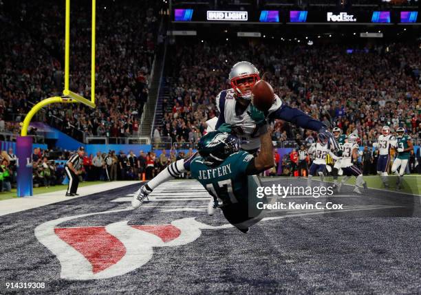 Alshon Jeffery of the Philadelphia Eagles misses the pass attempt under pressure from Stephon Gilmore of the New England Patriots during the second...