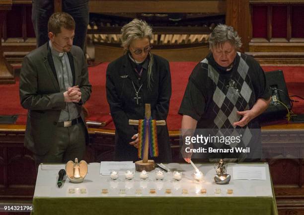 Senior Pastor Rev. Jeff Rock, Rev. Sam Morris and Rev. Deana Dudley light the five candles, one for each of the victims of serial killer Bruce...
