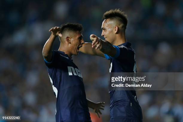 Lautaro Martinez of Racing Club celebrates with teammates after scoring the third goal of his team during a match between Racing Club and Huracan as...