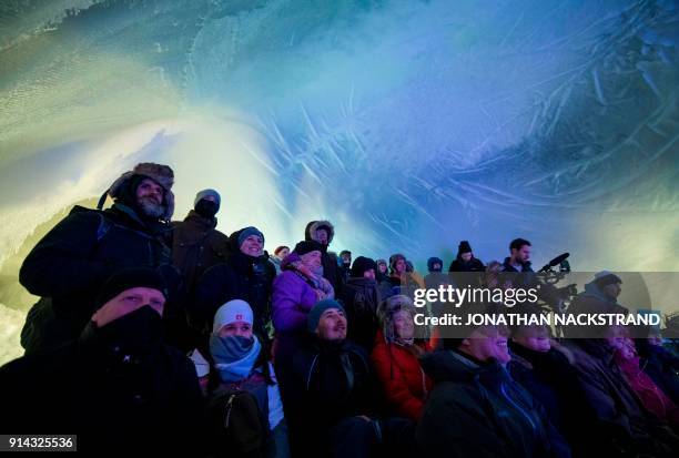 People attend the Ice Music Festival on February 2, 2018 in the small mountain village of Finse in the municipality of Ulvik in southern Norway.? A...