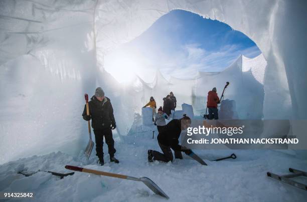 Organisers build a structure of ice ahead of the Ice Music Festival on February 2, 2018 in the small mountain village of Finse in the municipality of...