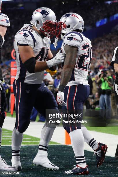 James White of the New England Patriots celebrates with teammates after a 26-yard touchdown run against the Philadelphia Eagles during the second...
