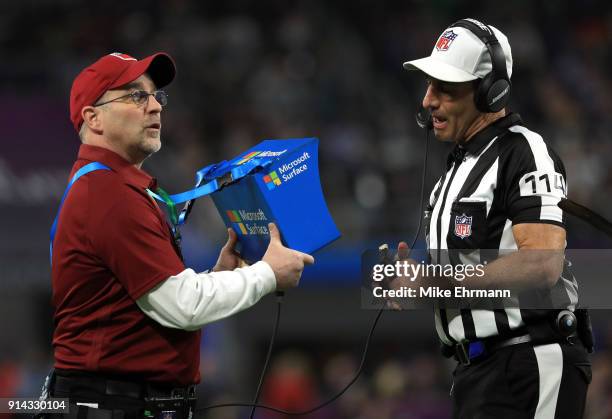 Referee Gene Steratore checks the replay of the Philadelphia Eagles touchdown against the New England Patriots during the third quarter in Super Bowl...