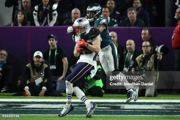 Chris Hogan of the New England Patriots is tackled by Rodney McLeod of the Philadelphia Eagles in the third quarter of Super Bowl LII at U.S. Bank...