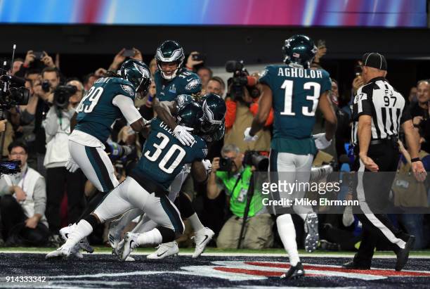 Corey Clement of the Philadelphia Eagles celebrates his 22 yard touchdown catch with teammates Nelson Agholor and LeGarrette Blount against the New...