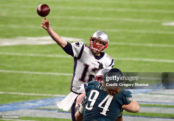 Tom Brady of the New England Patriots passes against Beau Allen of the Philadelphia Eagles during the third quarter in Super Bowl LII at U.S. Bank...