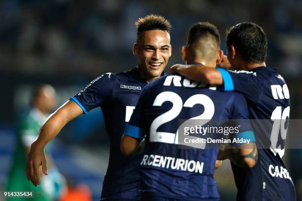 Lautaro Martinez of Racing Club celebrates with teammates after scoring the fourth goal of his team during a match between Racing Club and Huracan as...