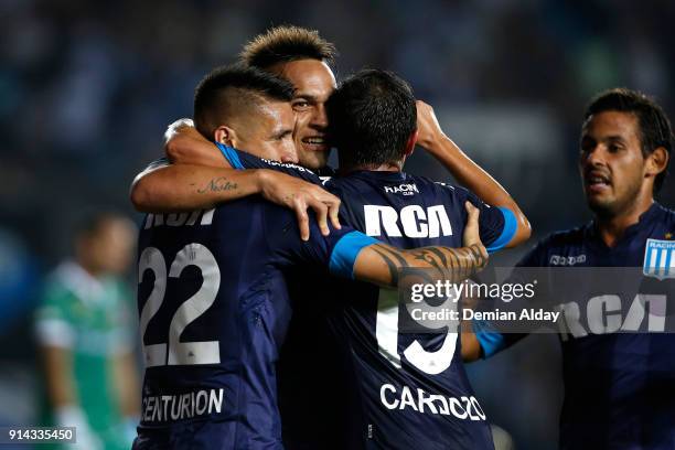 Lautaro Martinez of Racing Club celebrates with teammates after scoring the fourth goal of his team during a match between Racing Club and Huracan as...