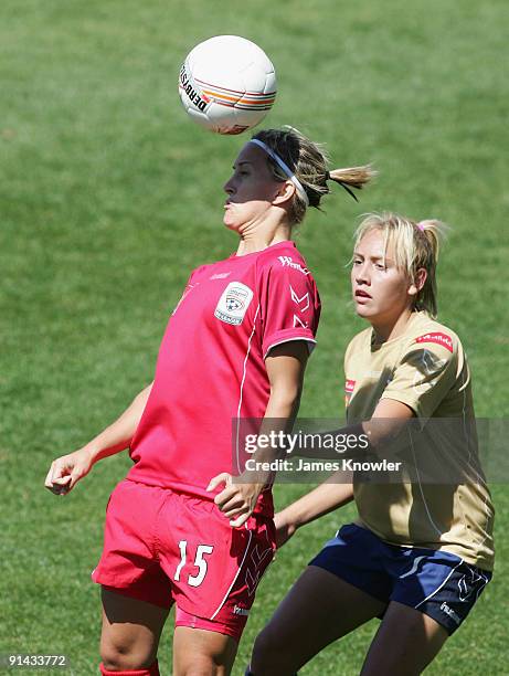 Teneille Boaler of United heads from Alsion Logue of the Jets during the round one W-League match between Adelaide United and the Newcastle Jets at...