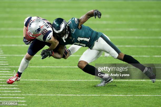 Jalen Mills of the Philadelphia Eagles tackles Danny Amendola of the New England Patriots during the fourth quarter in Super Bowl LII at U.S. Bank...