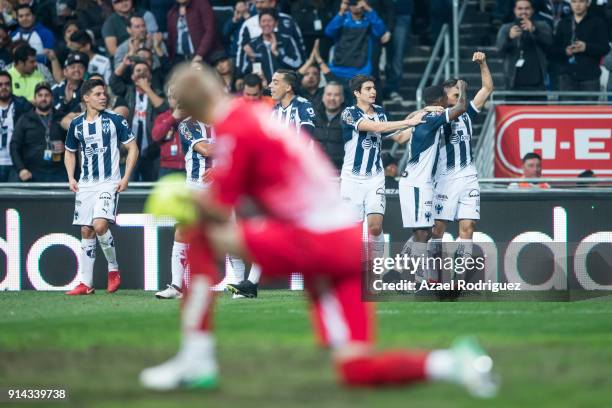Jonathan Urretaviscaya of Monterrey celebrates with teammates after scoring his team"s fifth goal during the 5th round match between Monterrey and...