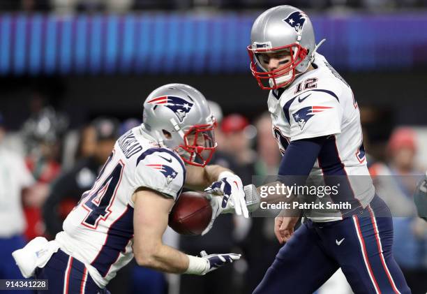 Tom Brady of the New England Patriots hands the ball off to Rex Burkhead against the Philadelphia Eagles during the fourth quarter in Super Bowl LII...