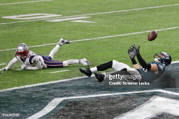 Zach Ertz of the Philadelphia Eagles scores an 11-yard fourth quarter touchdown past Devin McCourty of the New England Patriots in Super Bowl LII at...