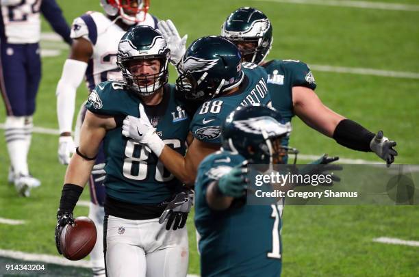 Zach Ertz of the Philadelphia Eagles celebrates his 11 yard touchdown catch with teammate Trey Burton during the fourth quarter against the New...