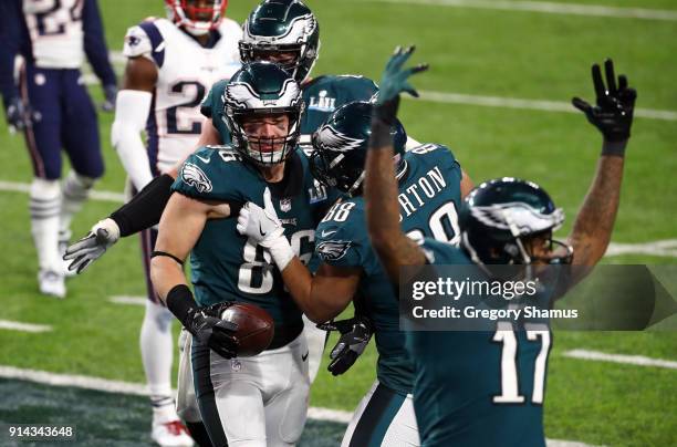 Zach Ertz of the Philadelphia Eagles celebrates his 11 yard touchdown catch with teammates Trey Burton and Alshon Jeffery during the fourth quarter...