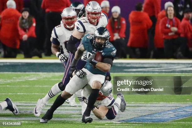 Derek Barnett of the Philadelphia Eagles recovers the ball after teammate Brandon Graham sacked Tom Brady of the New England Patriots in the fourth...