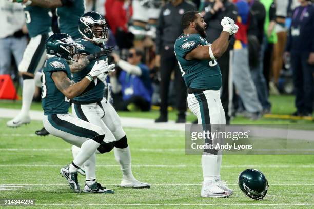 Brandon Graham of the Philadelphia Eagles celebrates with teammates after forcing a fumble by Tom Brady of the New England Patriots during the fourth...