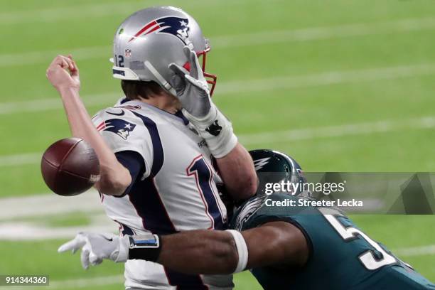 Tom Brady of the New England Patriots has the ball stripped by Brandon Graham of the Philadelphia Eagles late in the fourth quarter in Super Bowl LII...