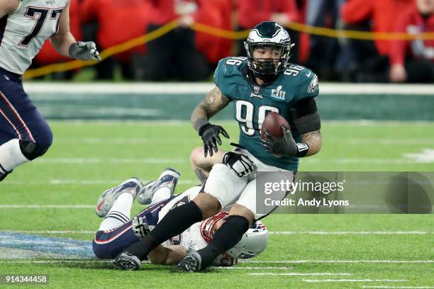 Derek Barnett of the Philadelphia Eagles recovers a fumble by Tom Brady of the New England Patriots during the fourth quarter in Super Bowl LII at...