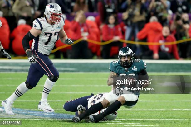 Derek Barnett of the Philadelphia Eagles recovers a fumble by Tom Brady of the New England Patriots during the fourth quarter in Super Bowl LII at...